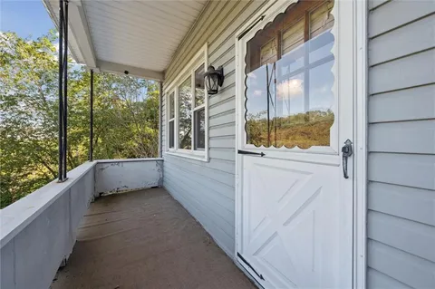 a view of balcony with furniture