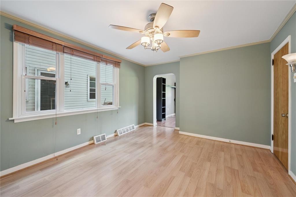 677 Greentree Road Pittsburgh, PA 15220 - Photo 10 of 29 a view of an empty room with wooden floor and a window