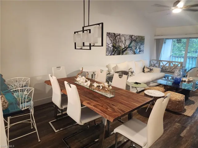 a view of a living room with furniture and a flat screen tv