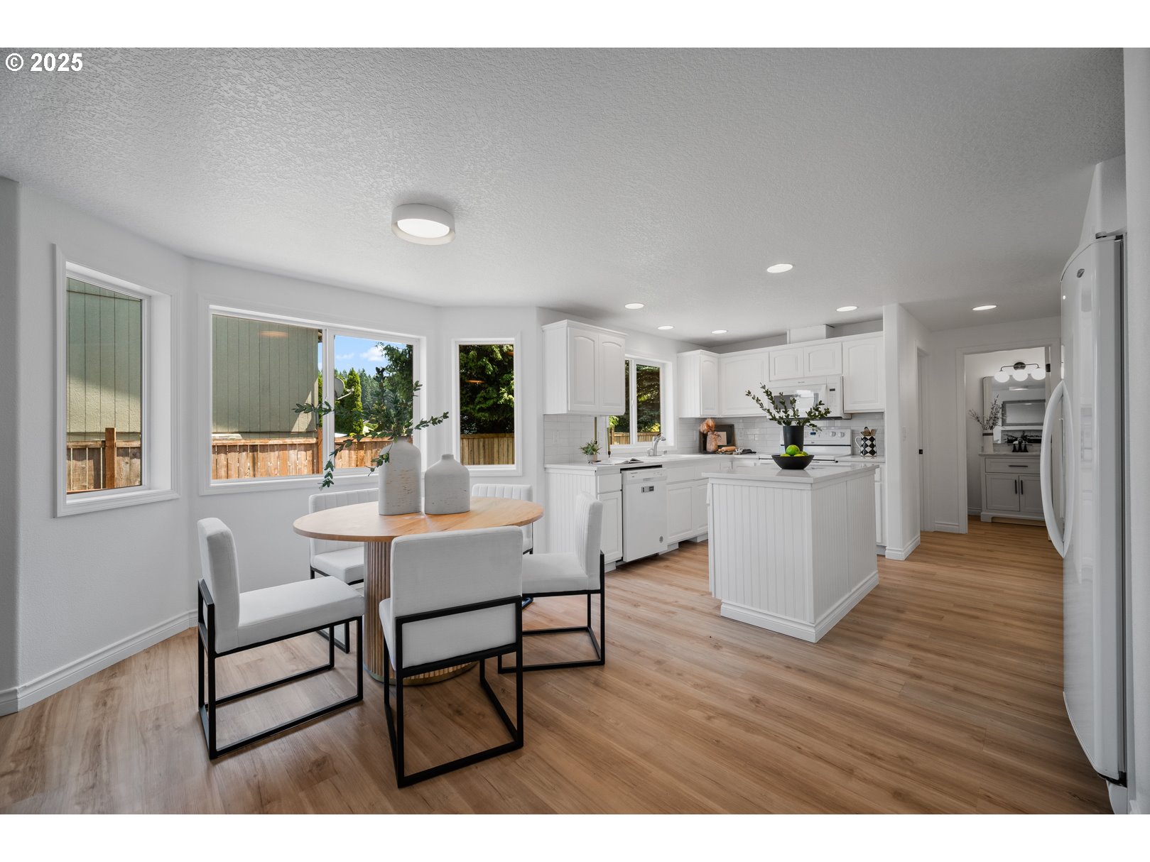 2952 Northwest Ogden Street Camas, WA 98607 - Photo 12 of 31 a living room with furniture and kitchen view with wooden floor