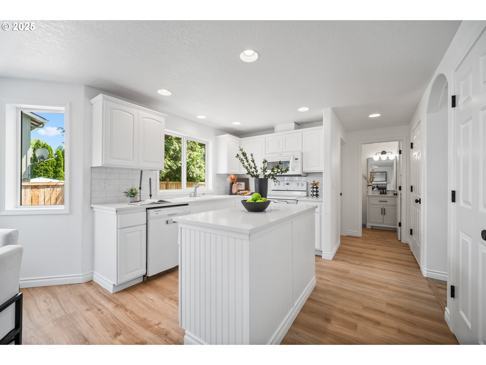 2952 Northwest Ogden Street Camas, WA 98607 - Photo 13 of 31 a kitchen with stainless steel appliances kitchen island a refrigerator sink and cabinets