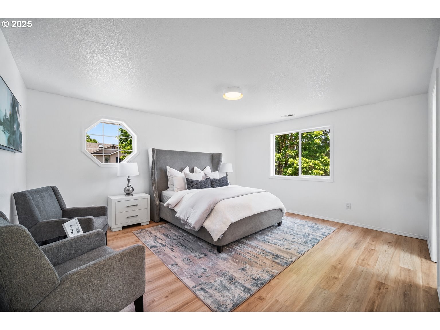 2952 Northwest Ogden Street Camas, WA 98607 - Photo 16 of 31 a bedroom with a bed and a couch