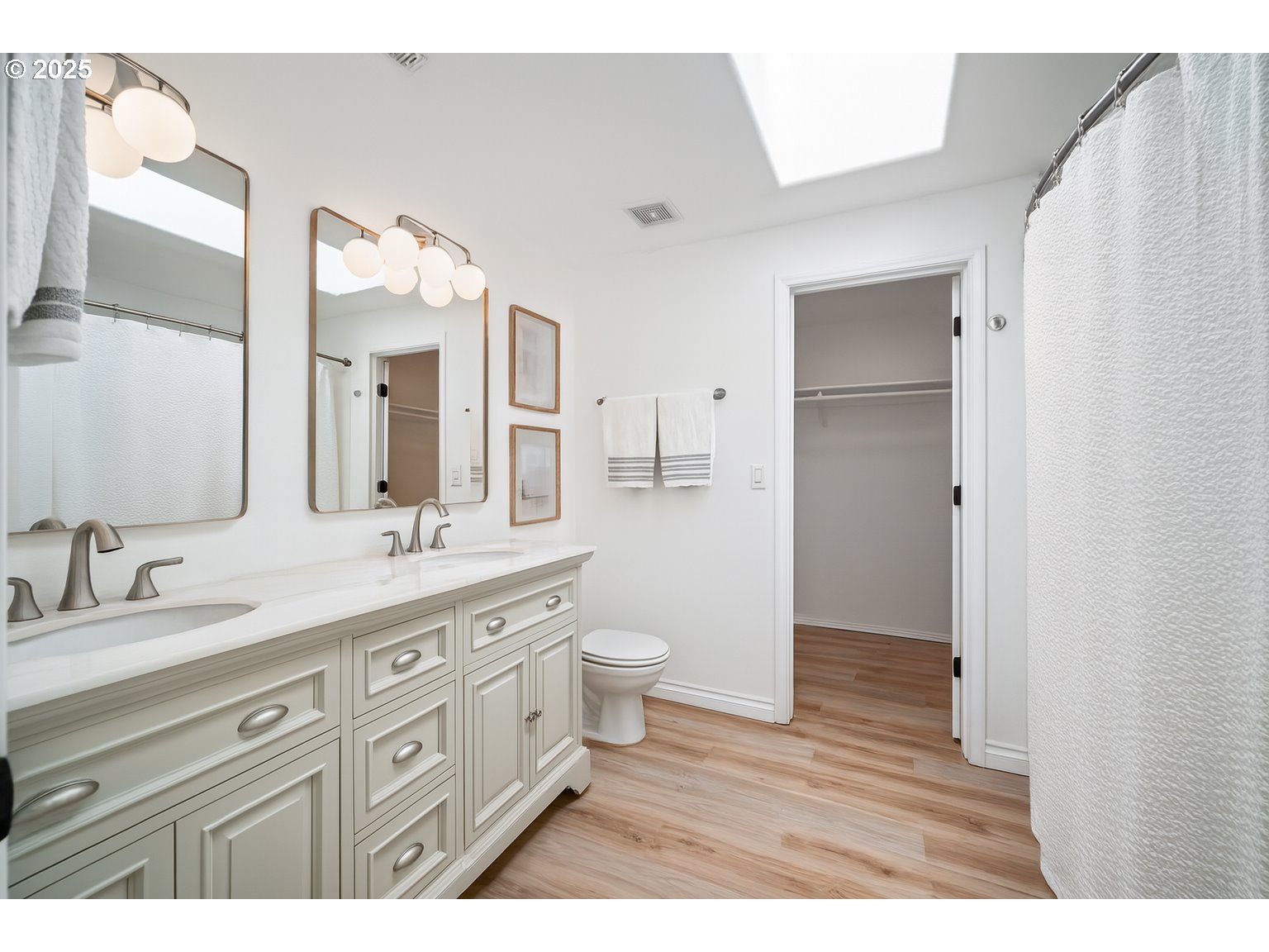 2952 Northwest Ogden Street Camas, WA 98607 - Photo 18 of 31 a large bathroom with a double vanity sink a toilet and a mirror