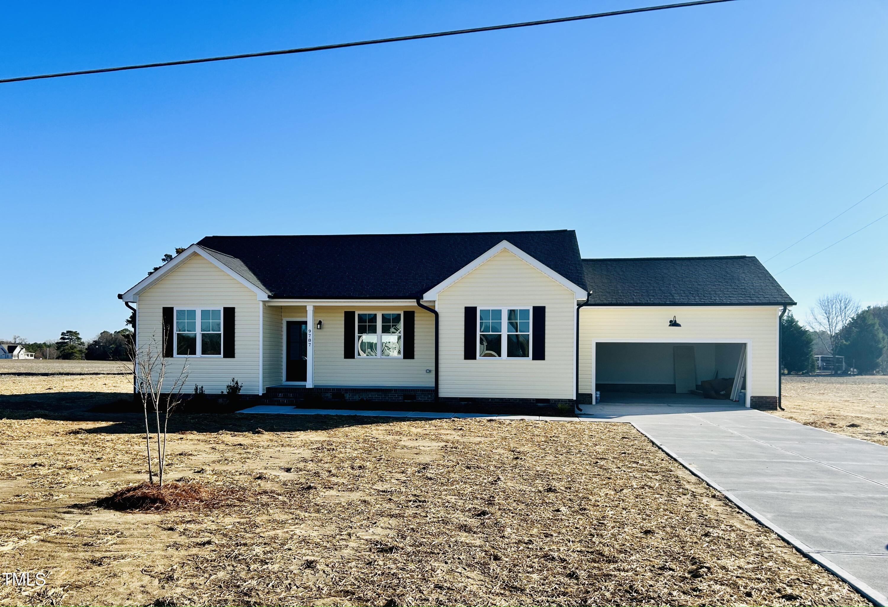 9787 Pace Road Bailey, NC 27807 - Photo 1 of 18 a front view of a house with a yard