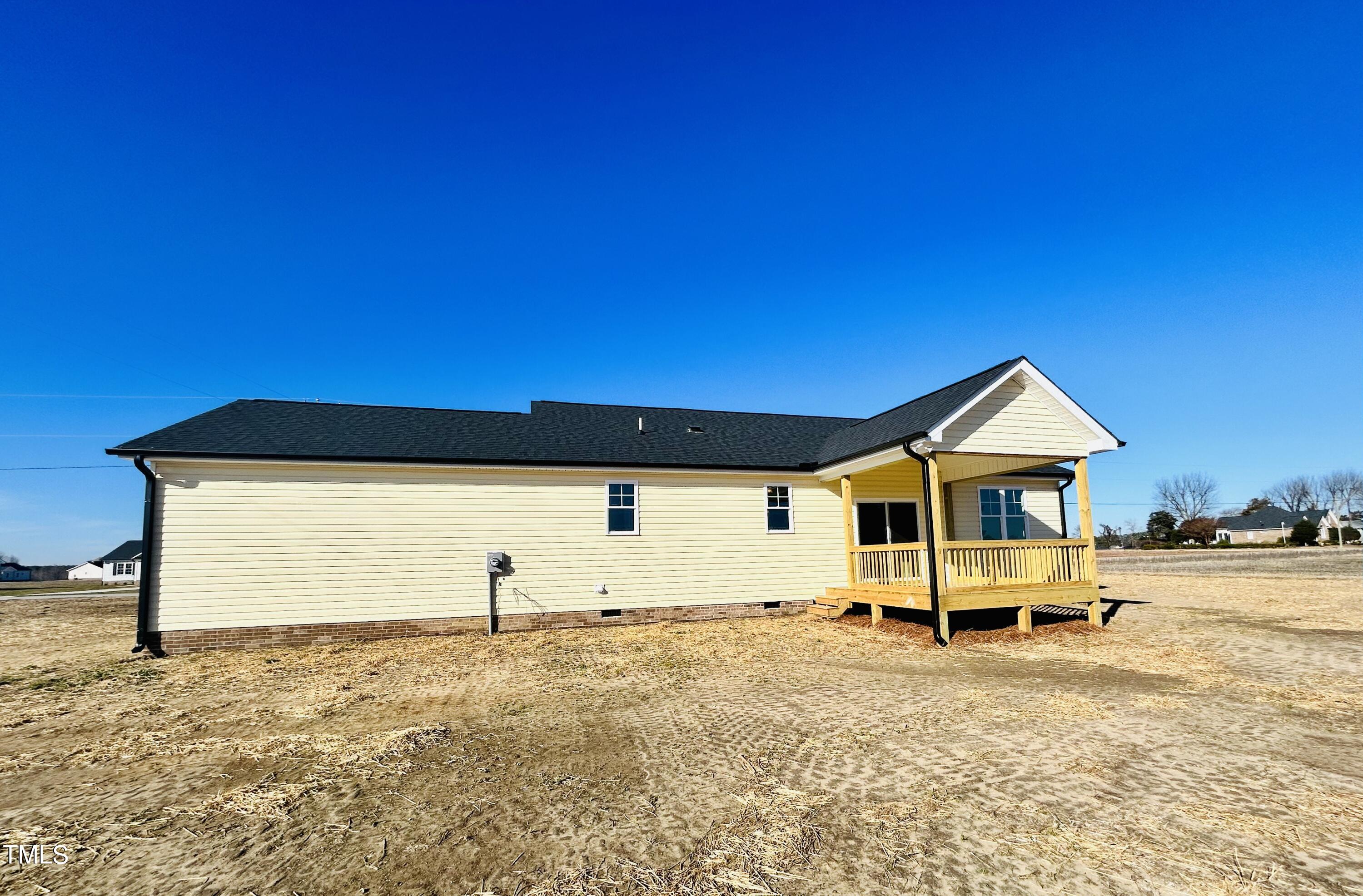 9787 Pace Road Bailey, NC 27807 - Photo 14 of 18 a front view of a house with a yard