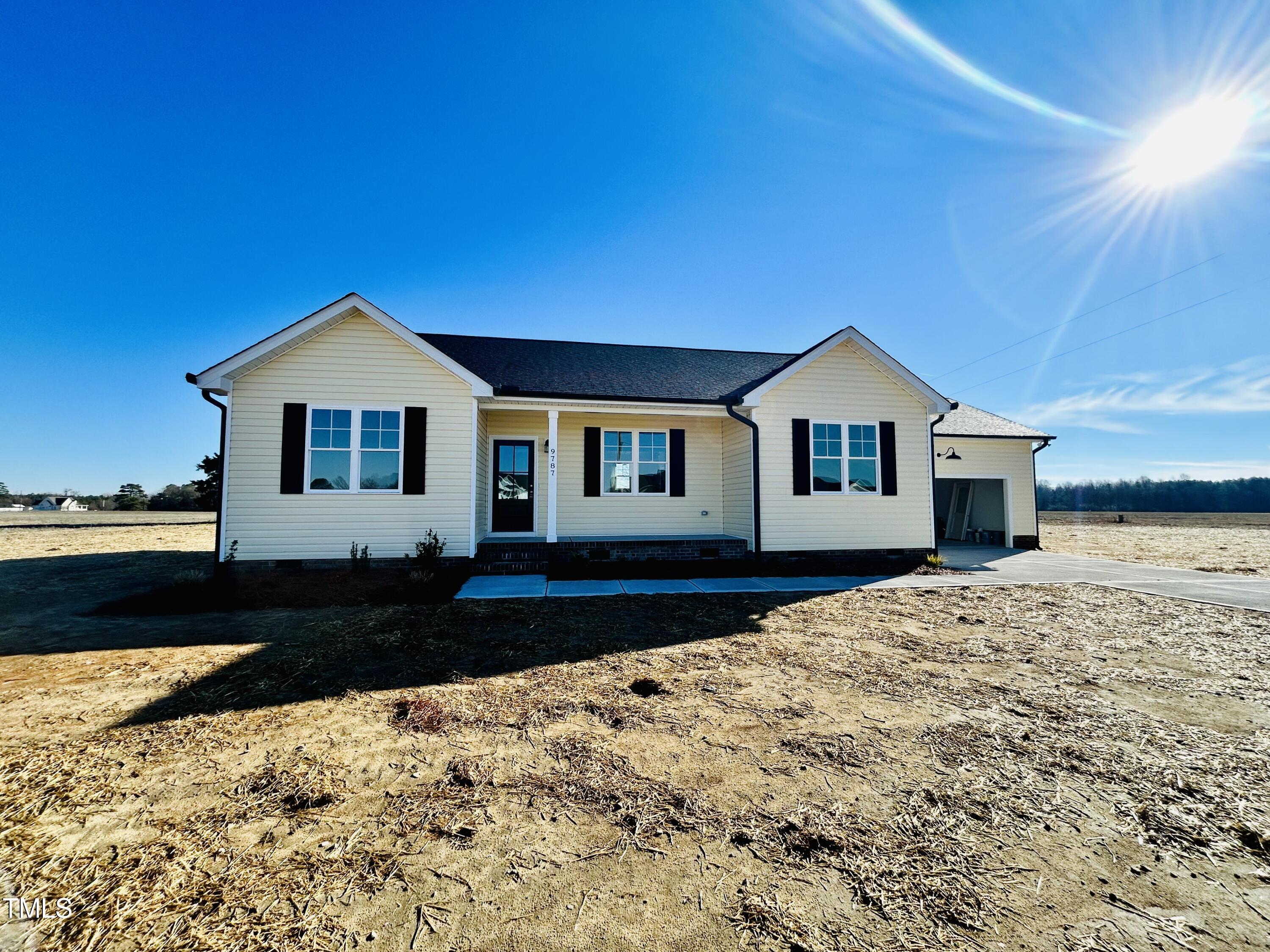 9787 Pace Road Bailey, NC 27807 - Photo 2 of 18 a front view of a house with a yard
