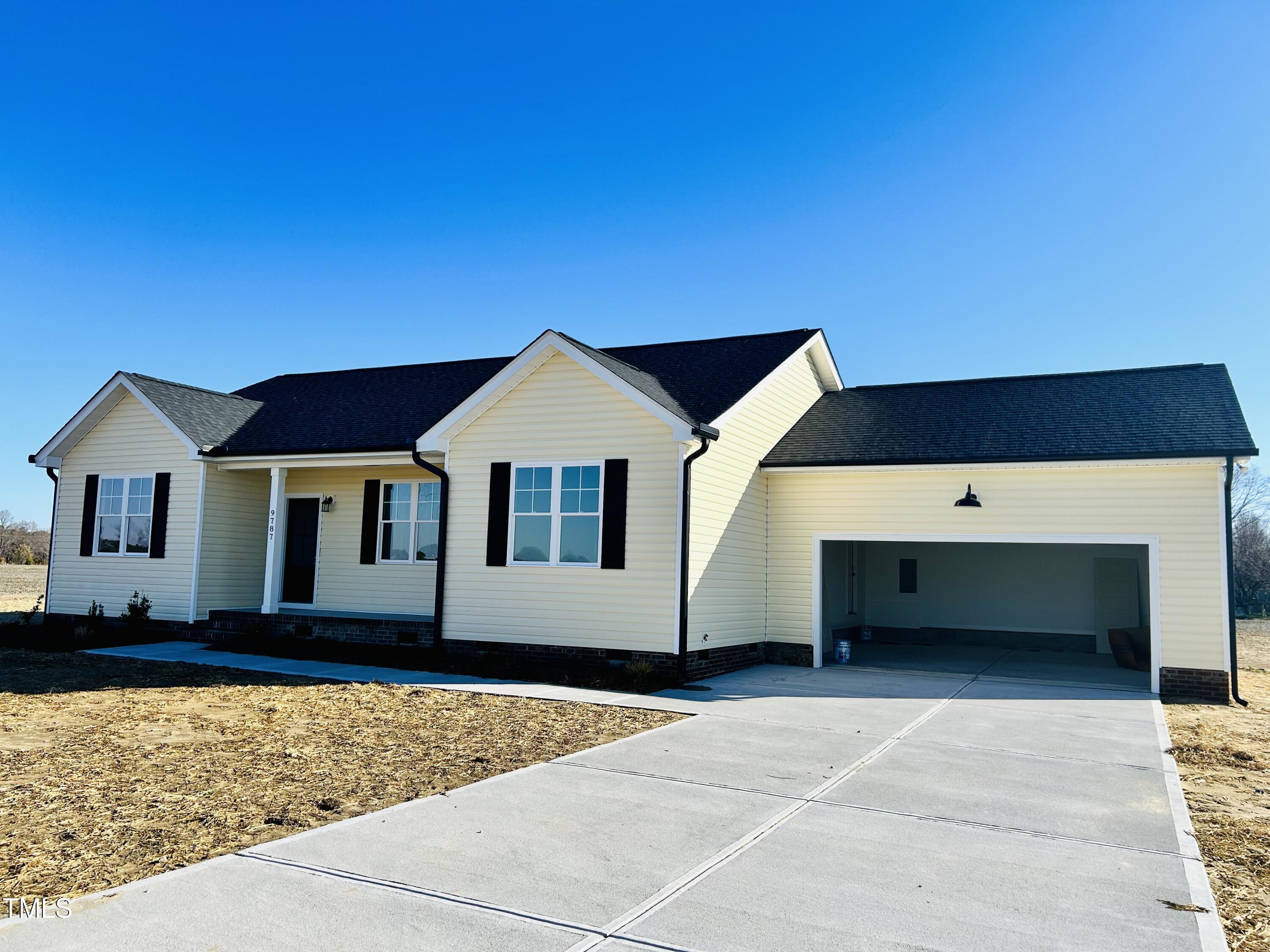9787 Pace Road Bailey, NC 27807 - Photo 3 of 18 a front view of a house with a yard