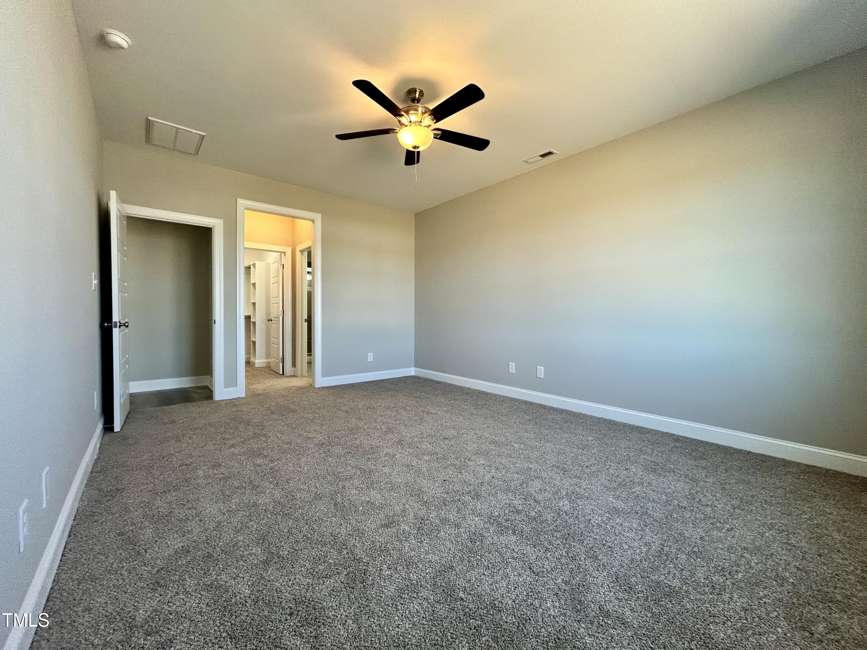 9787 Pace Road Bailey, NC 27807 - Photo 9 of 18 an empty room with closet and windows