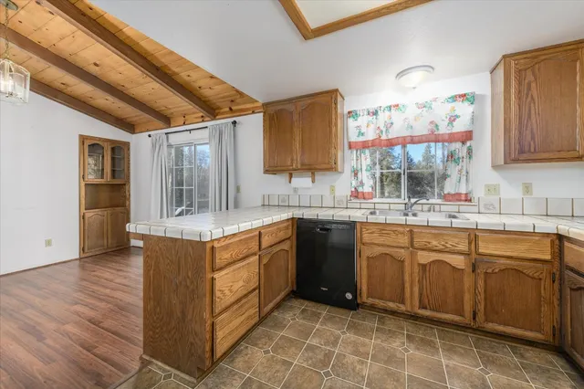 a kitchen with stainless steel appliances granite countertop a sink and cabinets
