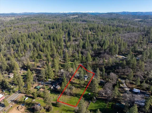 an aerial view of residential house with outdoor space
