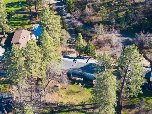 an aerial view of houses with yard