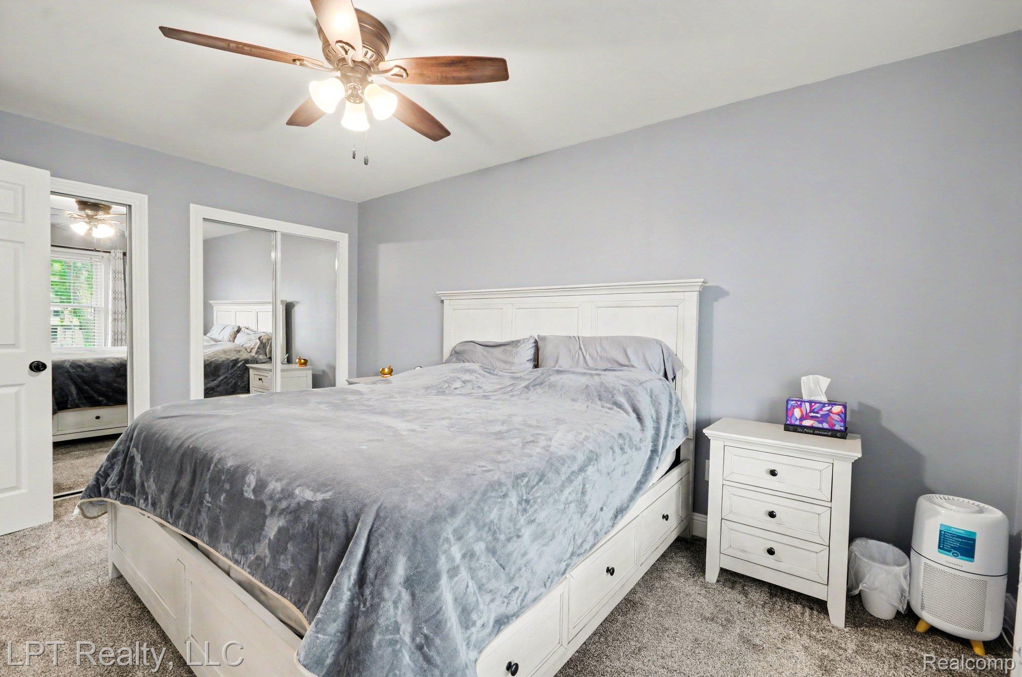 829 Langdon Court Rochester, MI 48307 - Photo 15 of 31 Bedroom featuring light wall paint and new neutral carpet