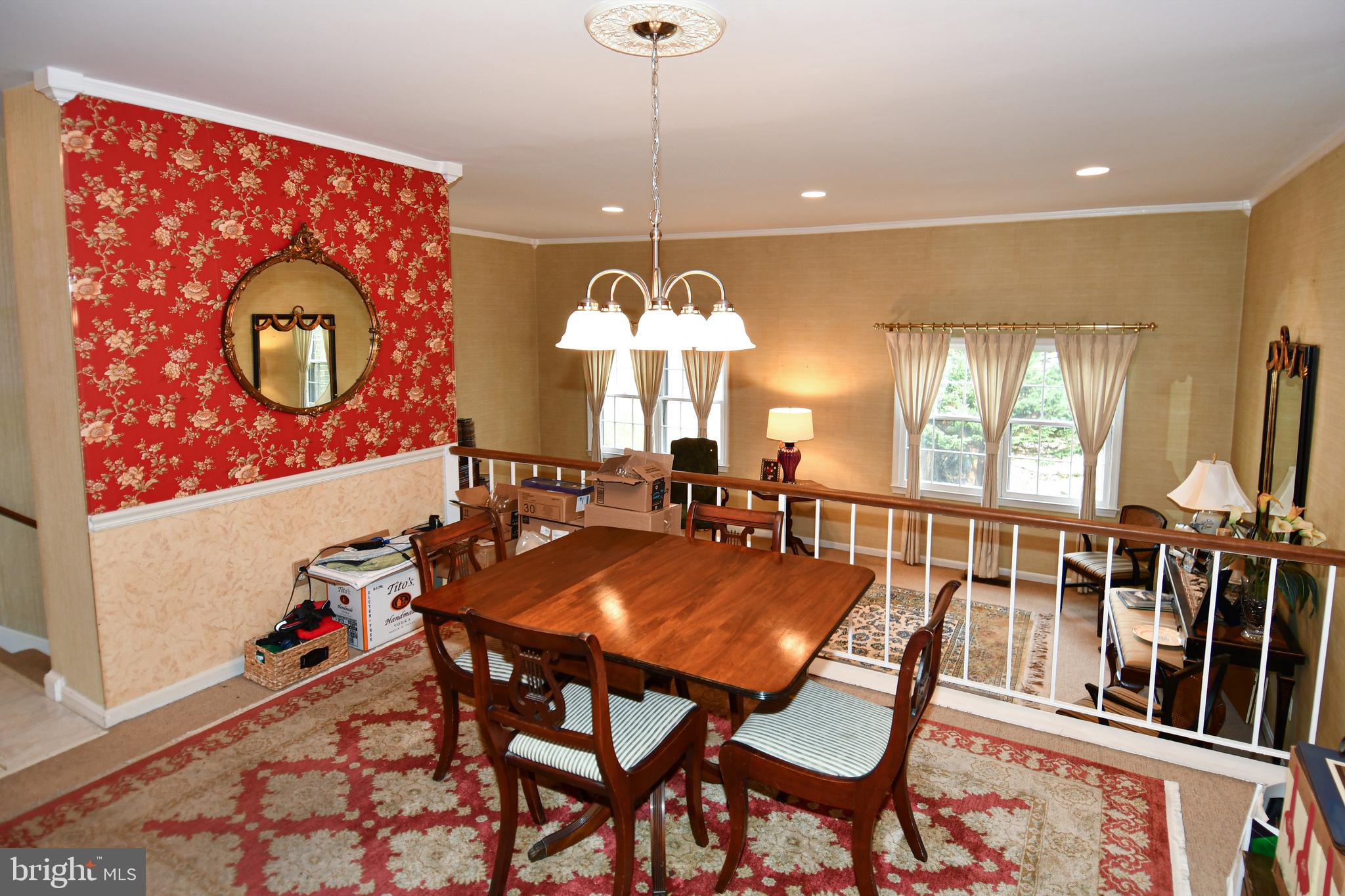 61 Oak Shade Road Gaithersburg, MD 20878 - Photo 12 of 42 a view of a dining room with furniture and chandelier