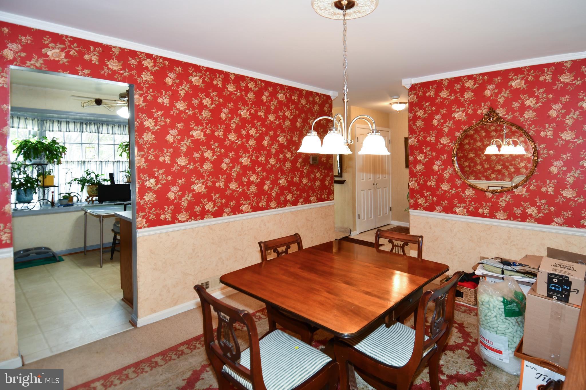 61 Oak Shade Road Gaithersburg, MD 20878 - Photo 14 of 42 a view of a dining room with furniture and wooden floor