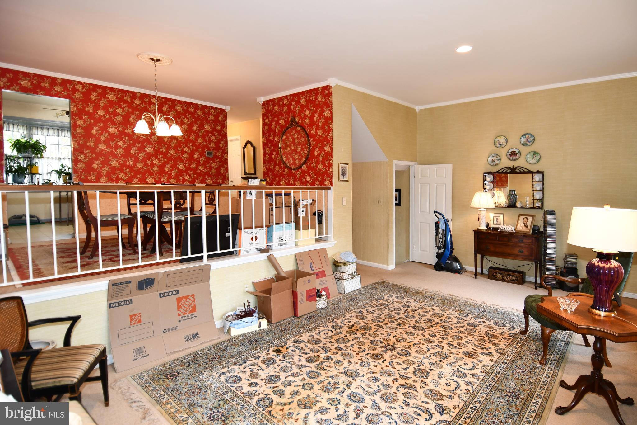 61 Oak Shade Road Gaithersburg, MD 20878 - Photo 18 of 42 a living room with furniture a rug and a large window