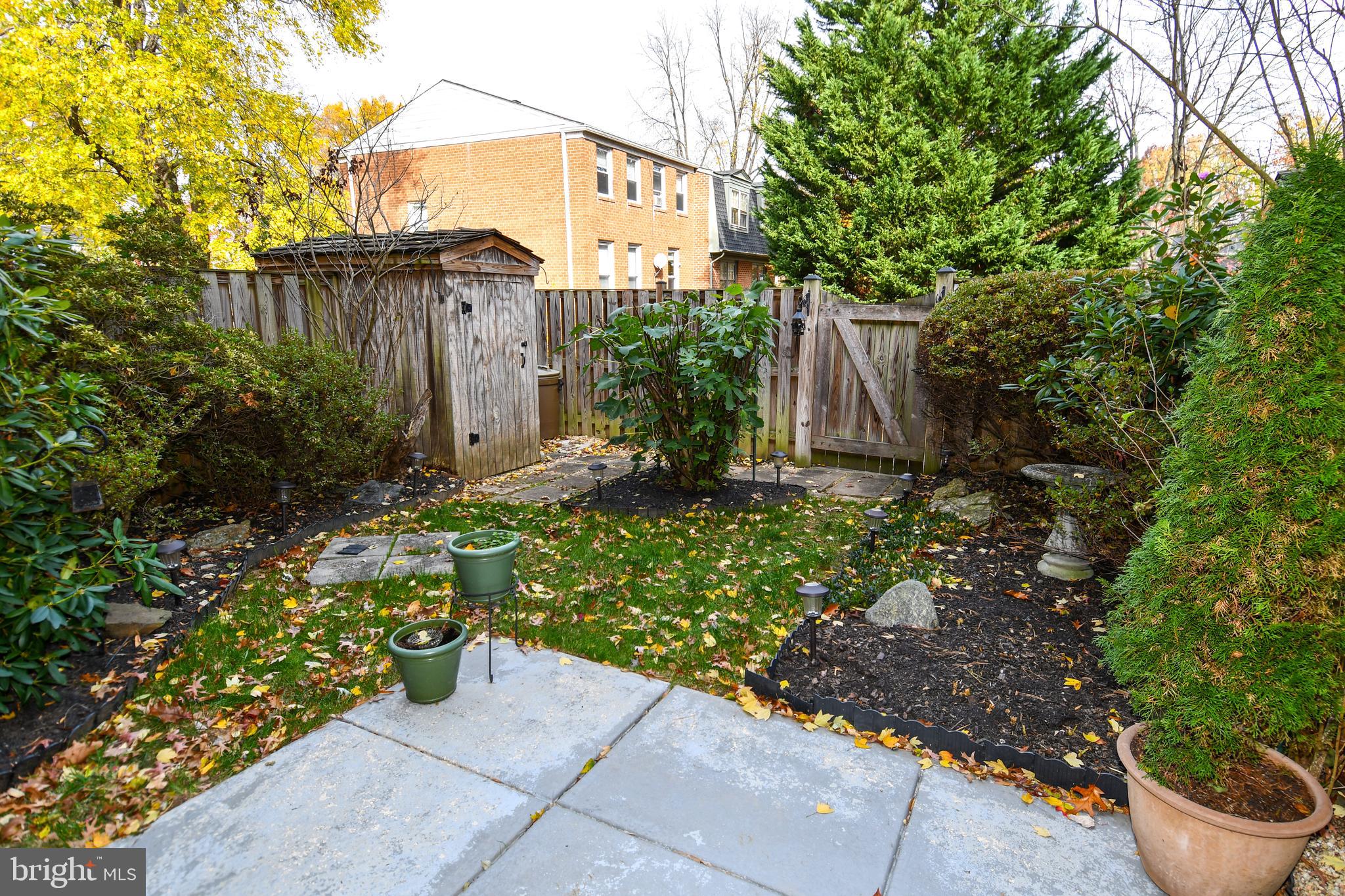 61 Oak Shade Road Gaithersburg, MD 20878 - Photo 27 of 42 a backyard of a house with lots of green space