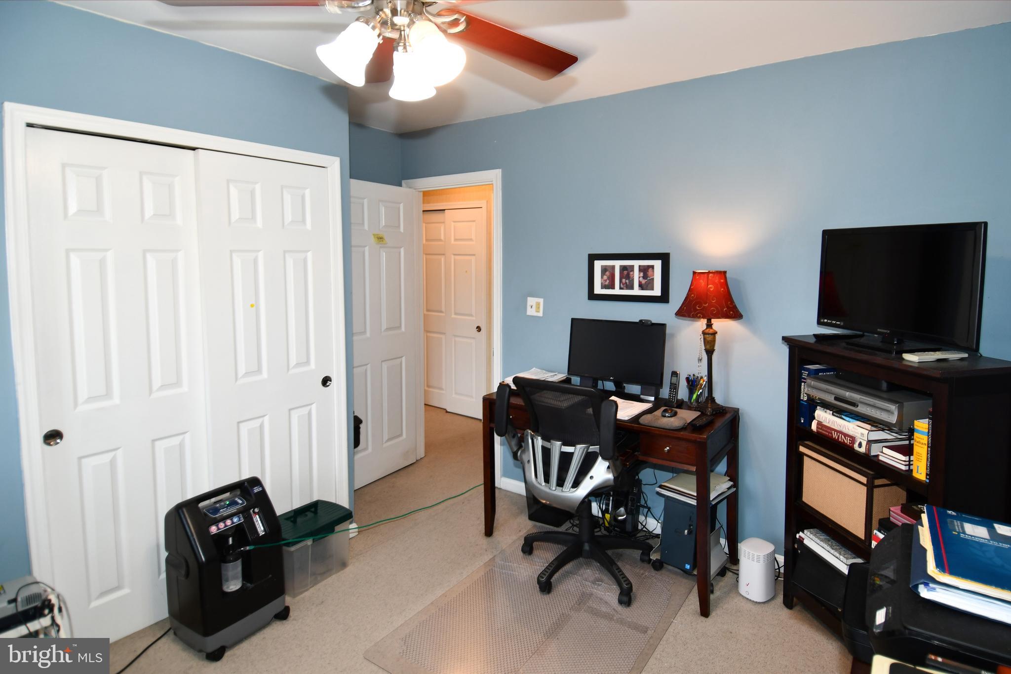 61 Oak Shade Road Gaithersburg, MD 20878 - Photo 30 of 42 a living room with furniture and a flat screen tv