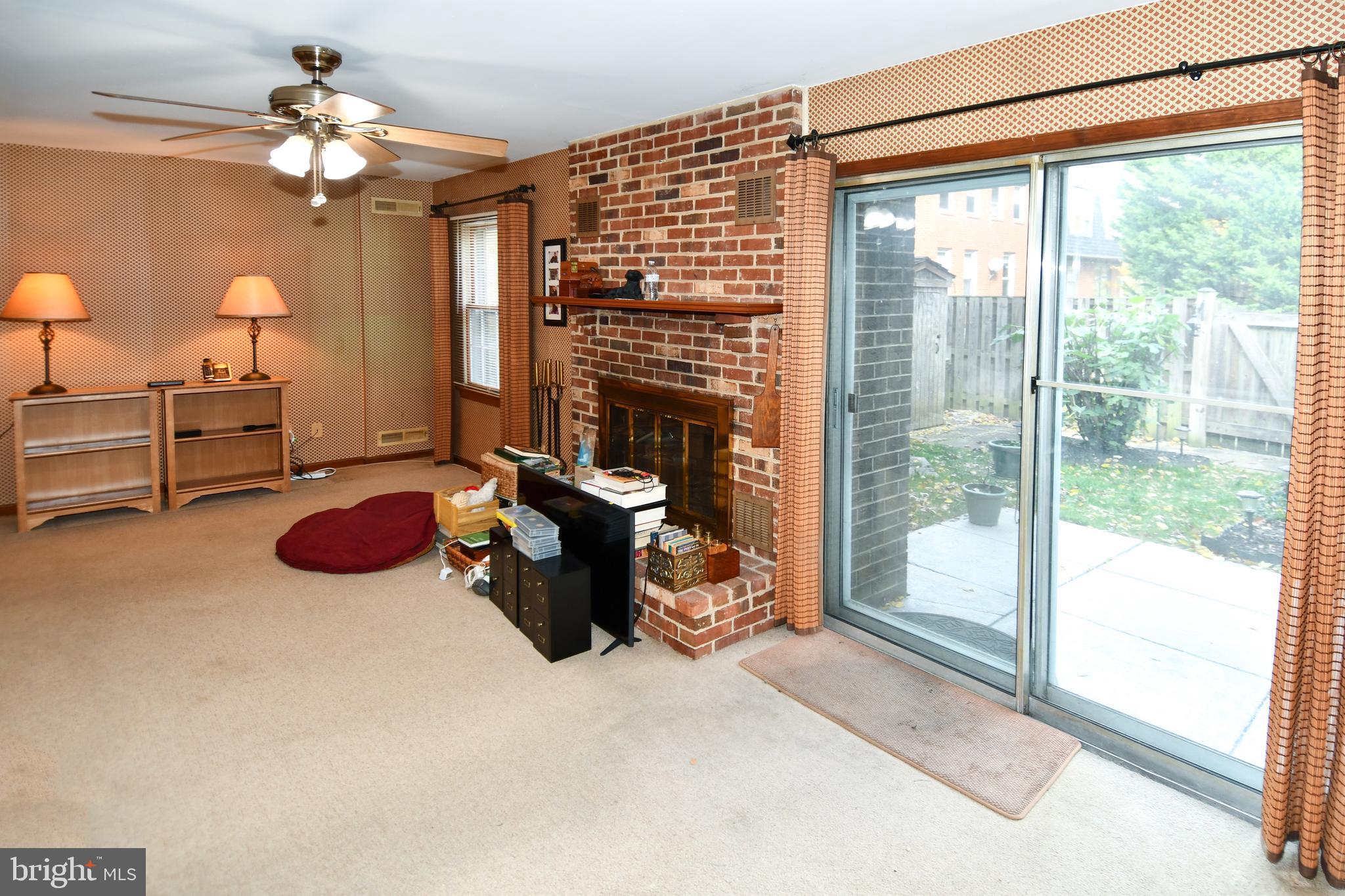 61 Oak Shade Road Gaithersburg, MD 20878 - Photo 3 of 42 a bedroom with furniture and a chandelier