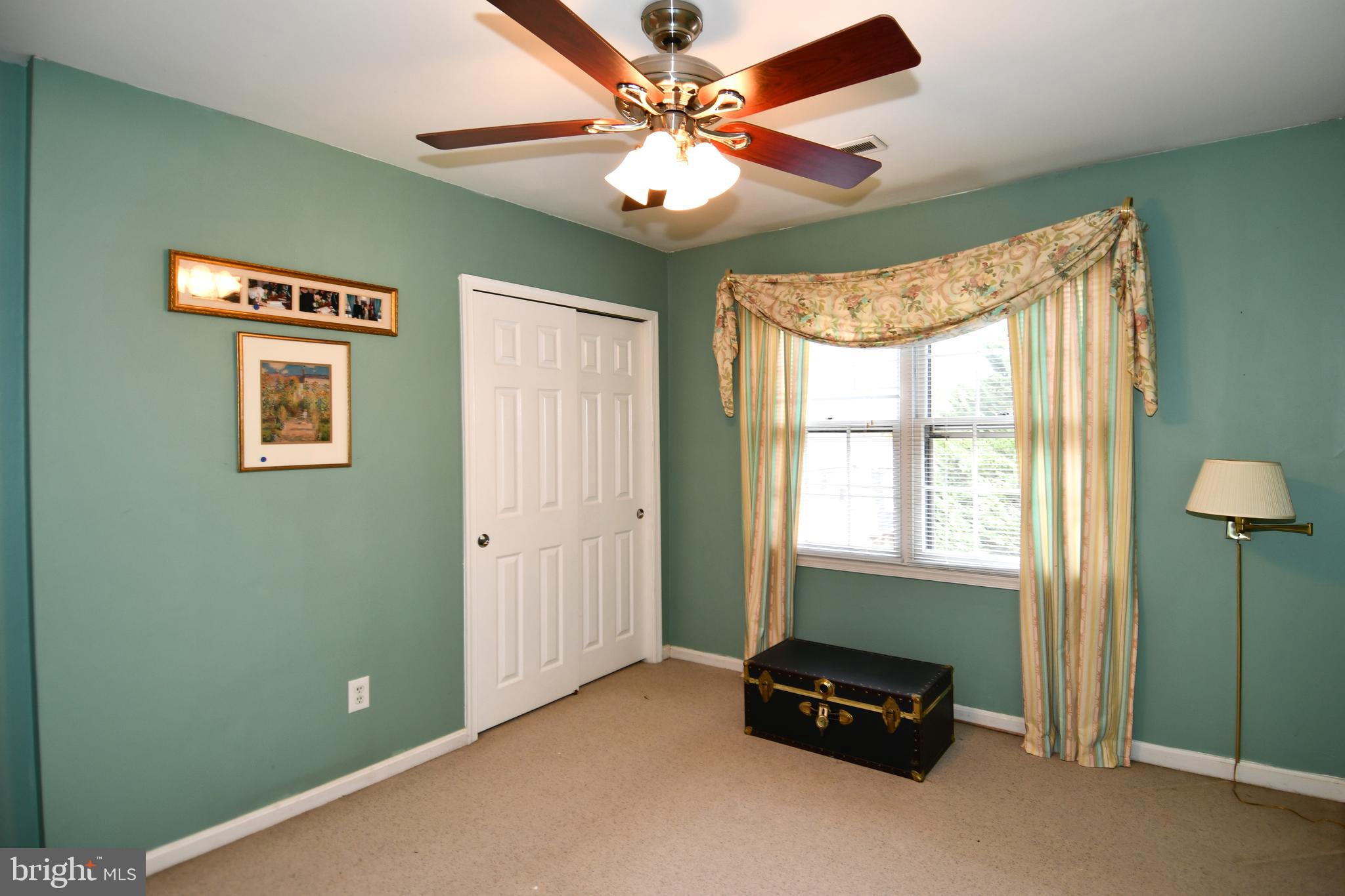 61 Oak Shade Road Gaithersburg, MD 20878 - Photo 32 of 42 a living room with furniture and a window