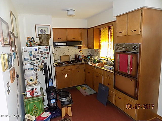 136 Beech Road Dingmans Ferry, PA 18328 - Photo 8 of 13 a kitchen with stainless steel appliances a refrigerator sink and cabinets