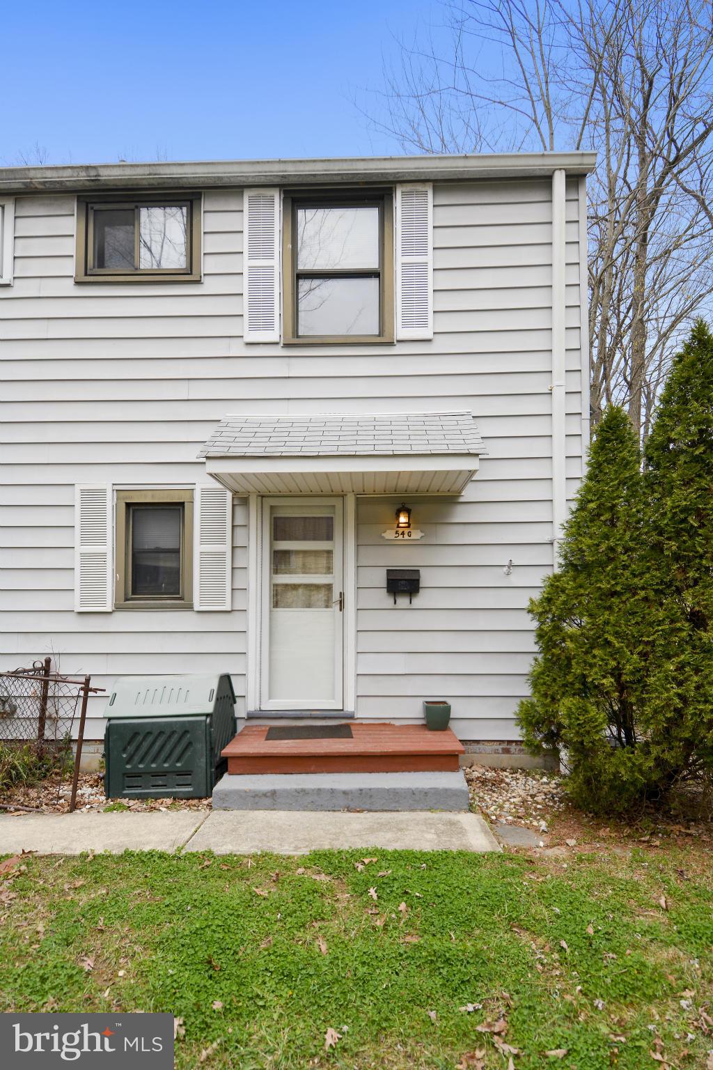 54 Ridge Road, Unit G Greenbelt, MD 20770 - Photo 2 of 30 a front view of a house with a yard