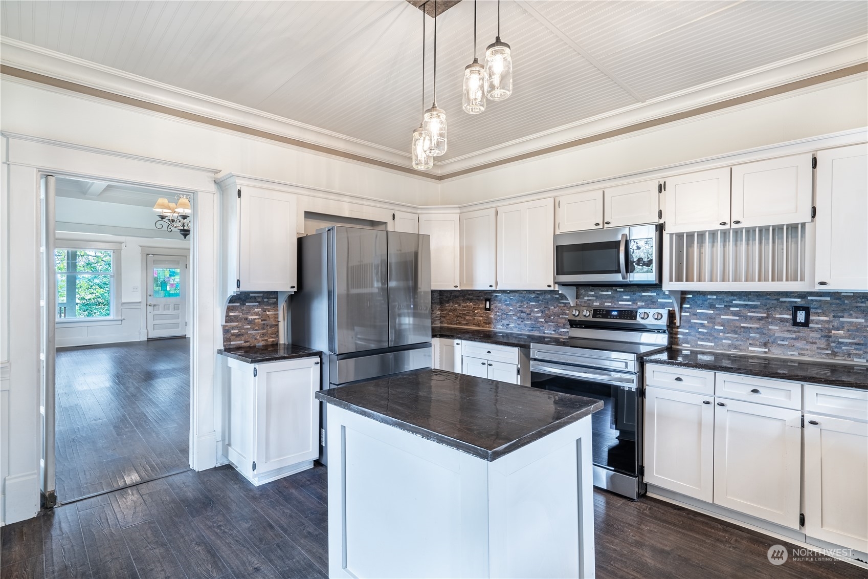 1049 Rush Road Chehalis, WA 98532 - Photo 11 of 40 a kitchen with a center island appliances and cabinets