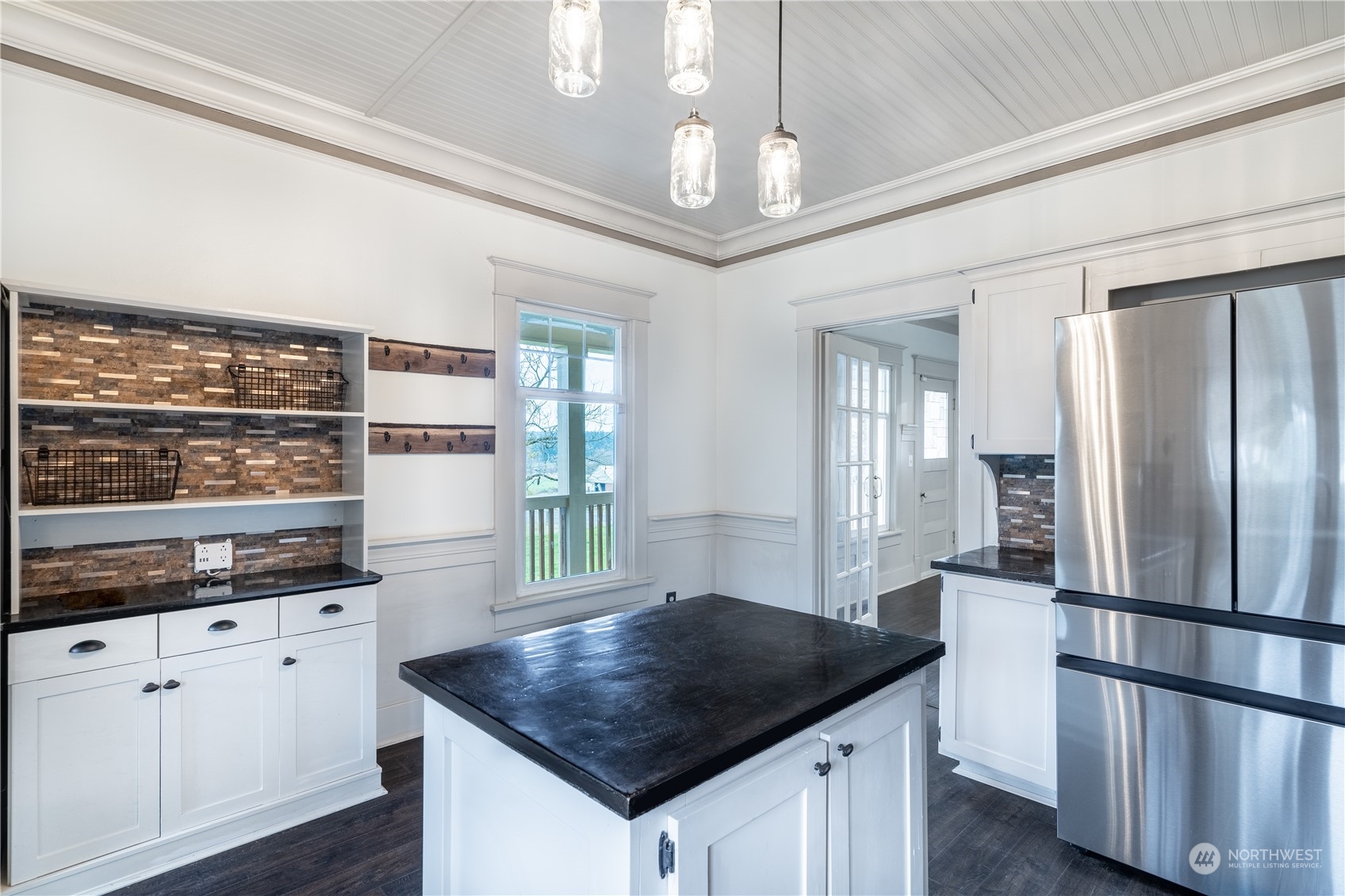 1049 Rush Road Chehalis, WA 98532 - Photo 12 of 40 a kitchen with stainless steel appliances granite countertop a refrigerator a sink dishwasher a stove and white cabinets with wooden floor