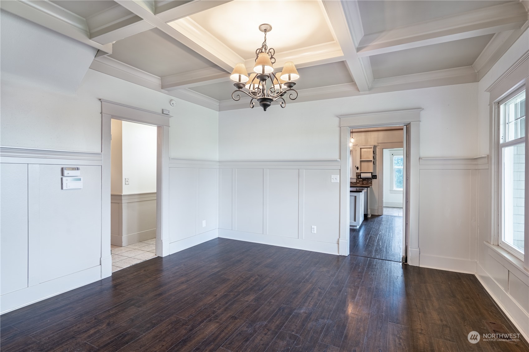 1049 Rush Road Chehalis, WA 98532 - Photo 15 of 40 a view of an empty room with a window and wooden floor