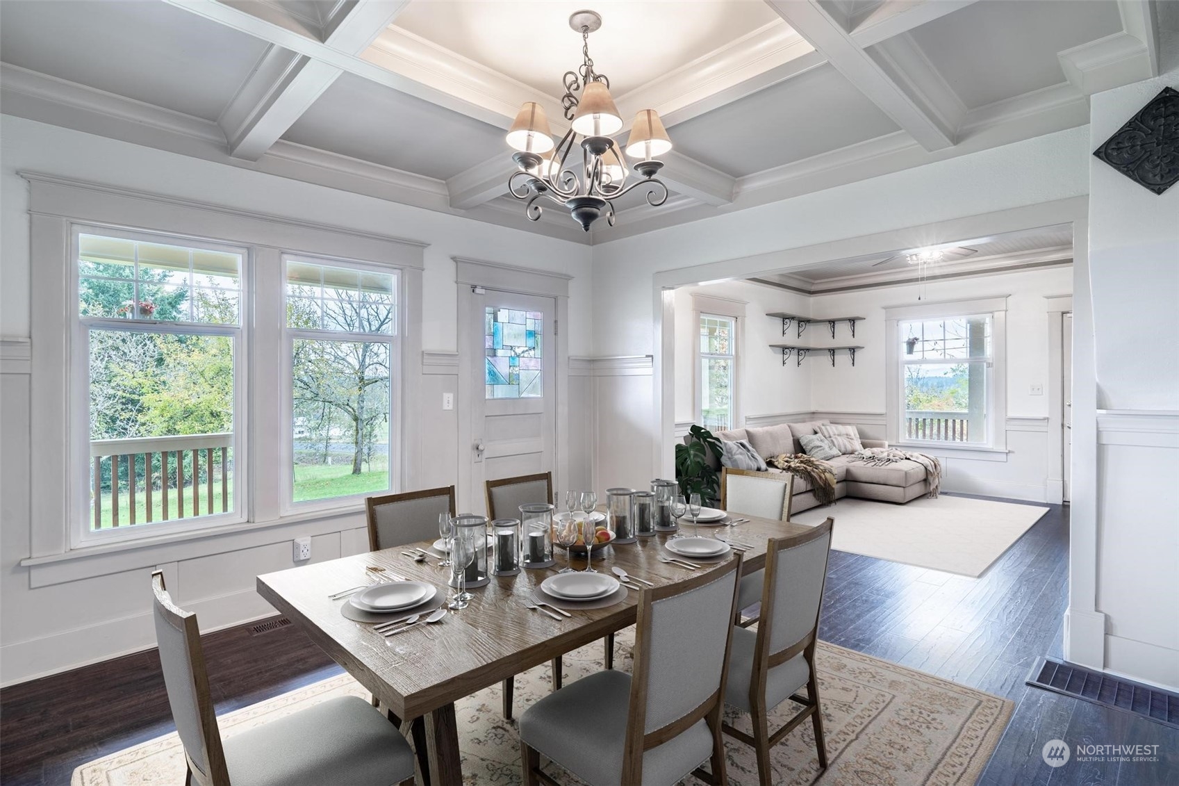 1049 Rush Road Chehalis, WA 98532 - Photo 16 of 40 a view of a dining room with furniture a chandelier and wooden floor