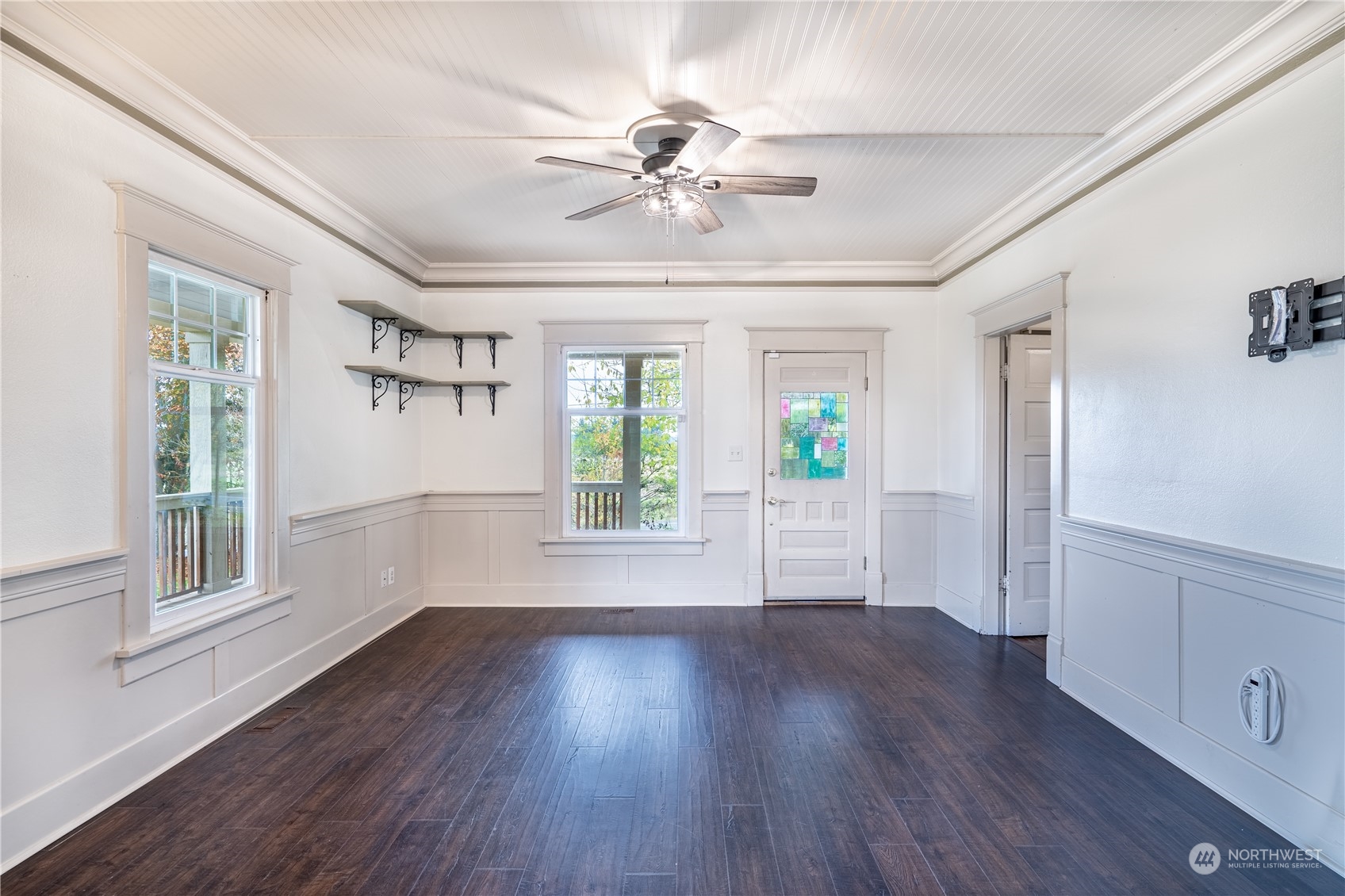 1049 Rush Road Chehalis, WA 98532 - Photo 17 of 40 a view of an empty room with wooden floor and a window