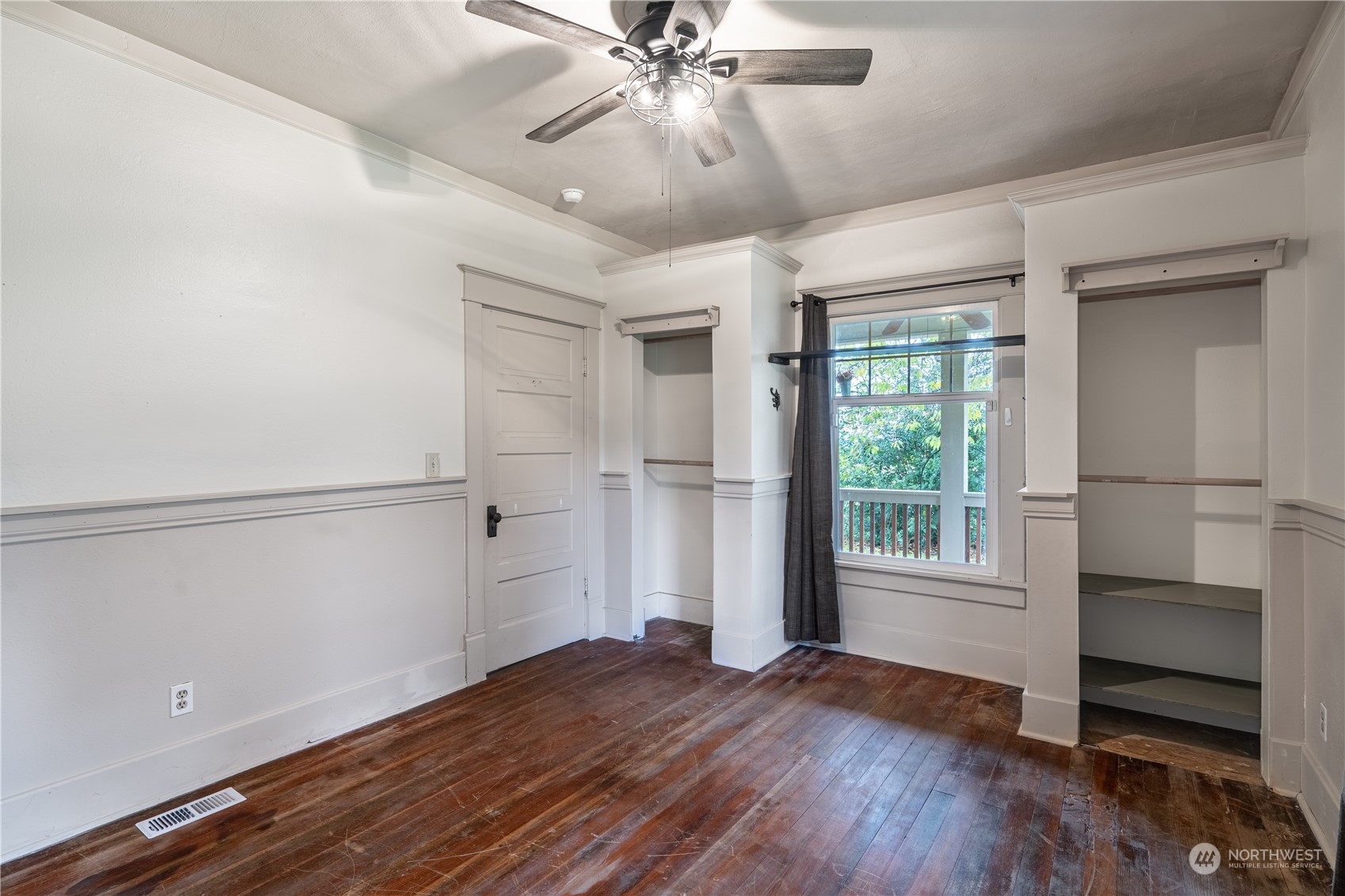 1049 Rush Road Chehalis, WA 98532 - Photo 19 of 40 a view of an empty room with a window and wooden floor