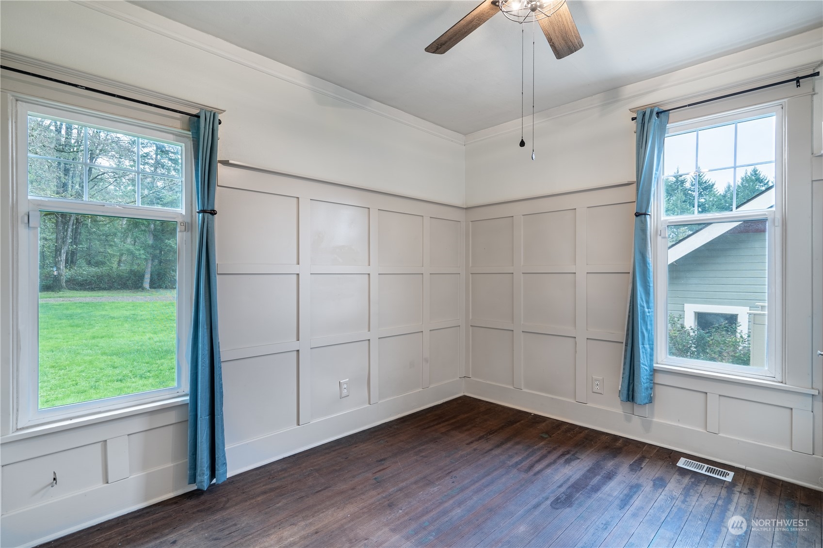 1049 Rush Road Chehalis, WA 98532 - Photo 22 of 40 a view of an empty room with a window and wooden floor