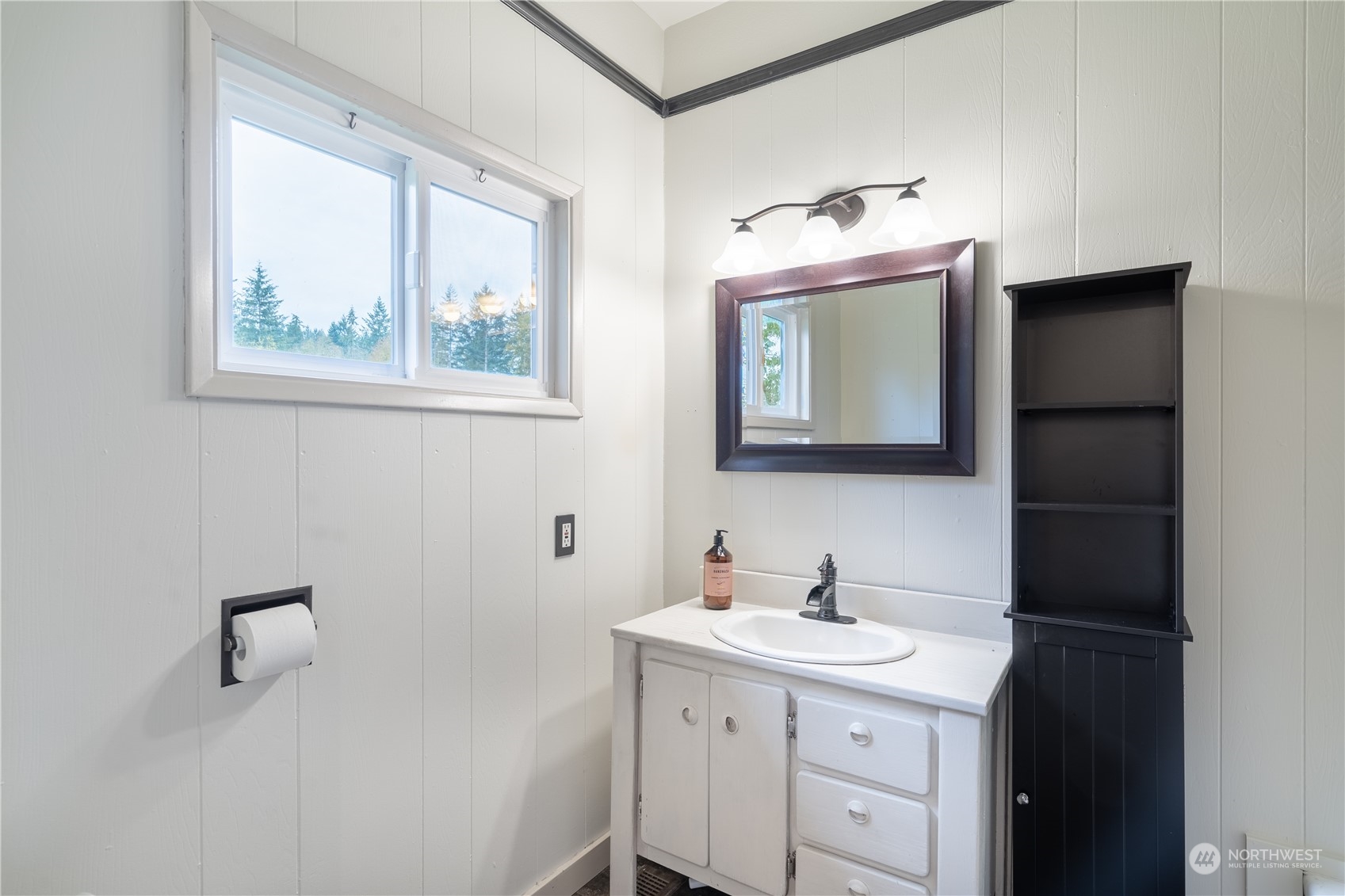 1049 Rush Road Chehalis, WA 98532 - Photo 32 of 40 a bathroom with a sink vanity and a mirror