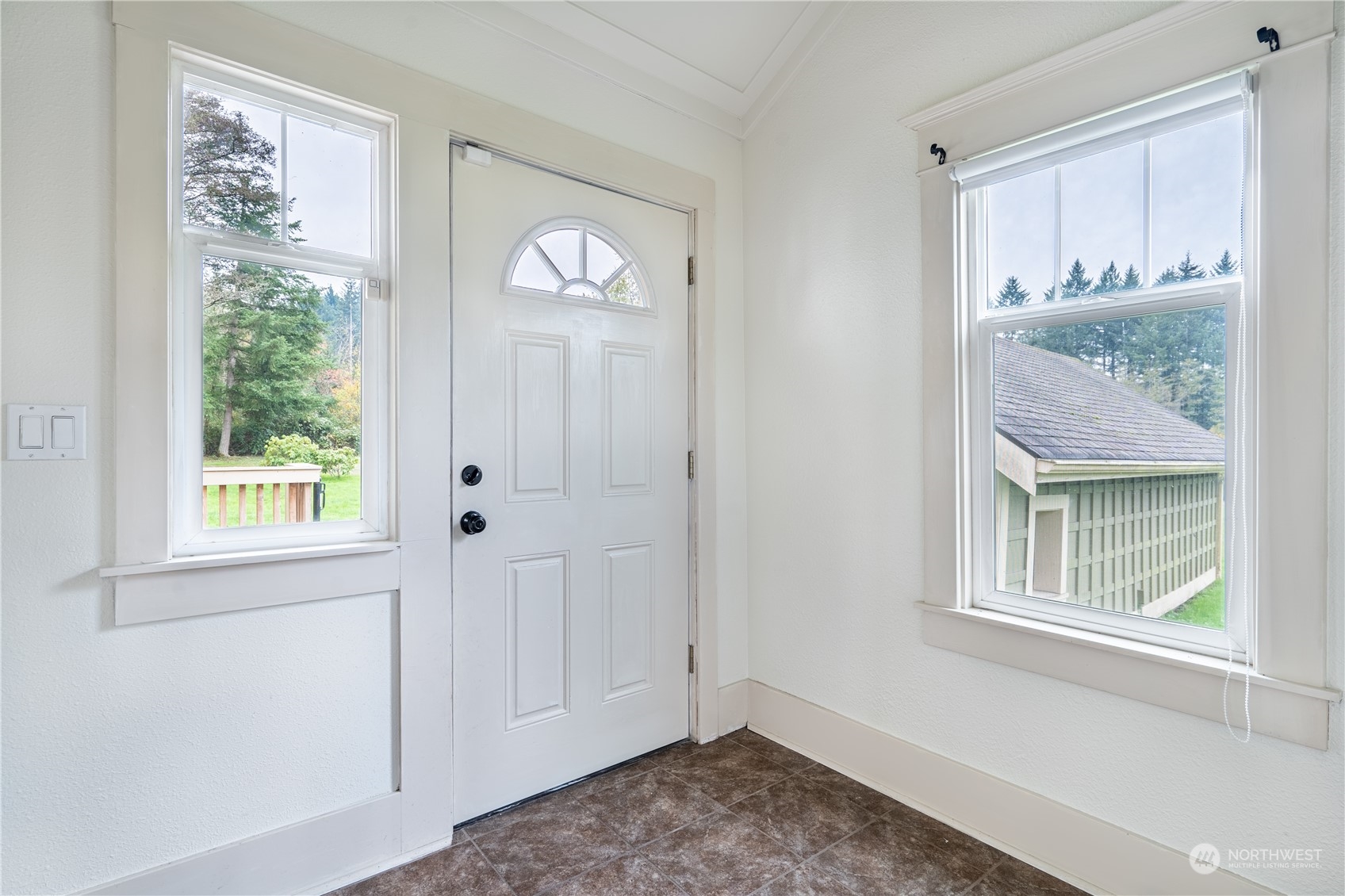 1049 Rush Road Chehalis, WA 98532 - Photo 35 of 40 a view of an empty room with window and wooden floor