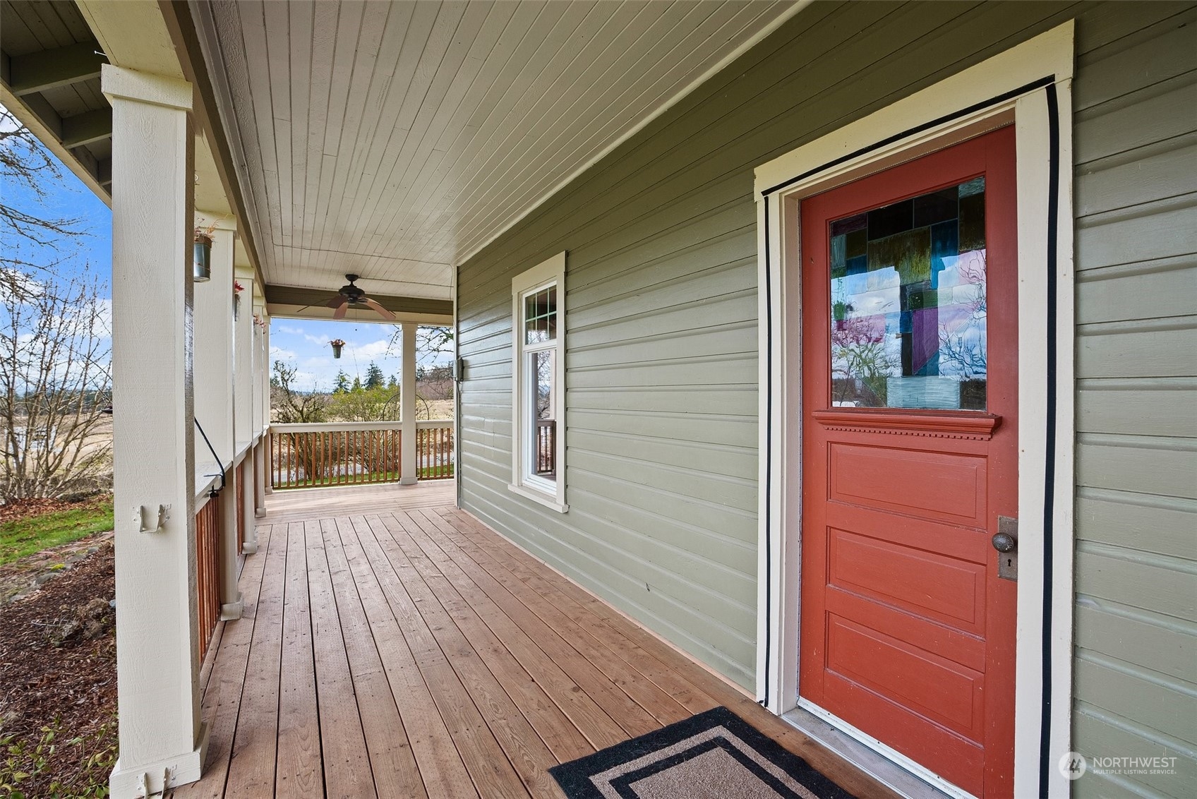 1049 Rush Road Chehalis, WA 98532 - Photo 8 of 40 a view of a porch with wooden floor and a table