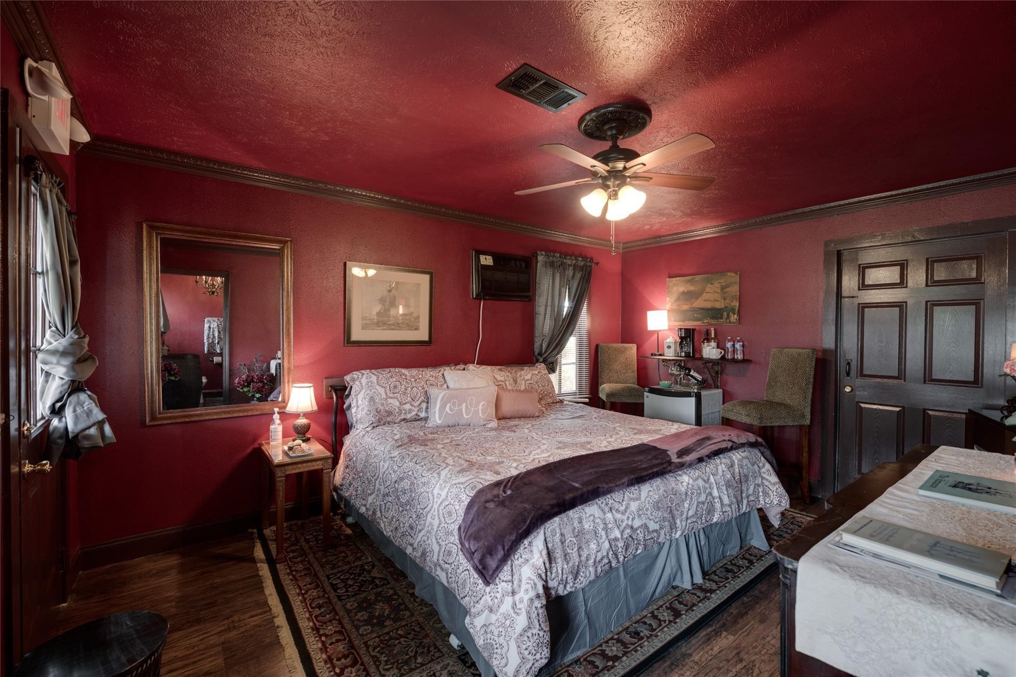 507 8th Street Kemah, TX 77565 - Photo 12 of 50 a spacious bedroom with a bed and a chandelier