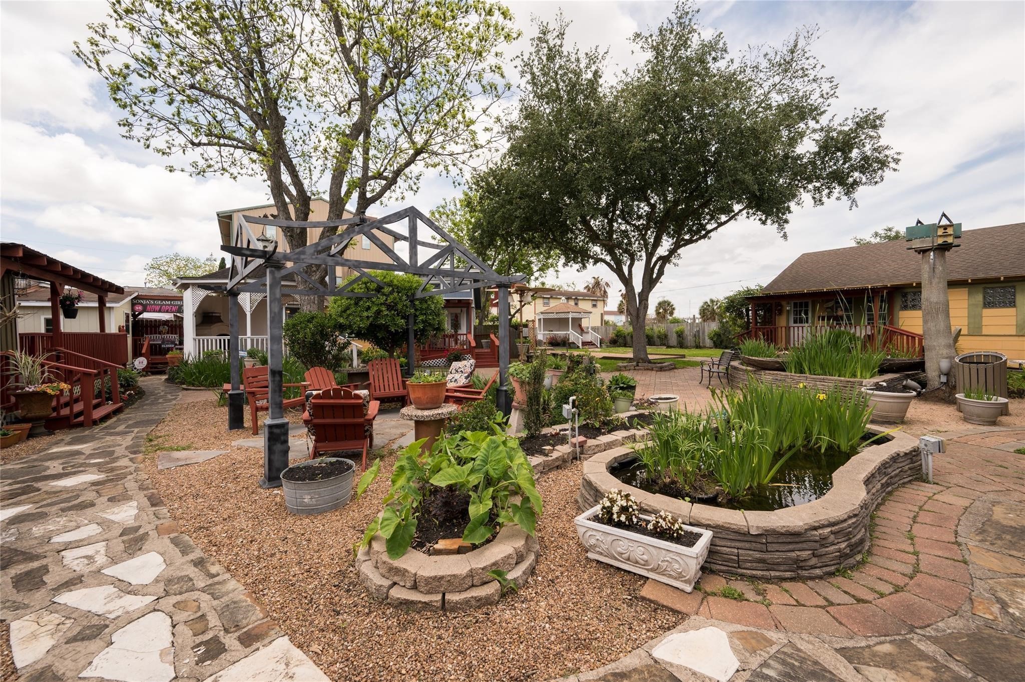 507 8th Street Kemah, TX 77565 - Photo 22 of 50 a view of a backyard with sitting area and garden