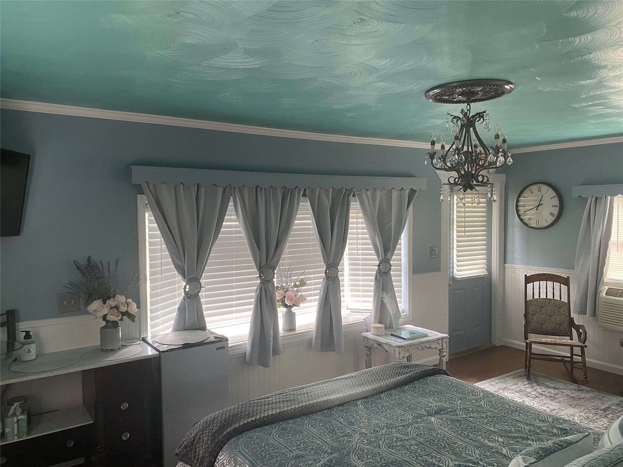 507 8th Street Kemah, TX 77565 - Photo 9 of 50 a room with chandelier fan and windows