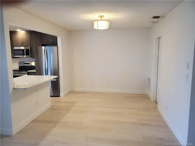 a view of a kitchen with a sink