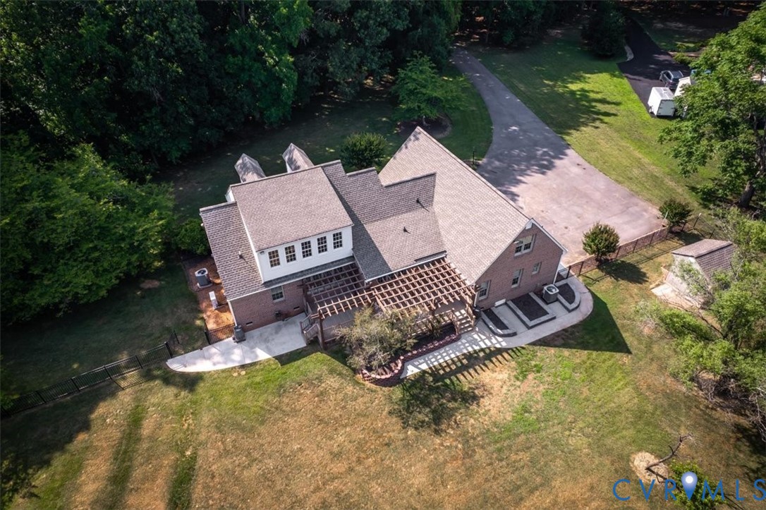 1437 Palmore Road Powhatan, VA 23139 - Photo 59 of 60 Brick exterior home with a gabled roof, rear patio
