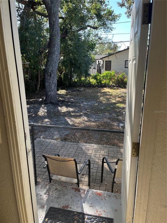 1485 Cleveland Street Clearwater, FL 33755 - Photo 14 of 14 a view of backyard with outdoor seating and plants