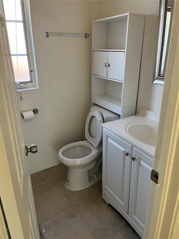 1485 Cleveland Street Clearwater, FL 33755 - Photo 3 of 14 a bathroom with a toilet and a sink