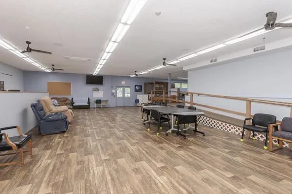 a living room with lots of furniture and a flat screen tv