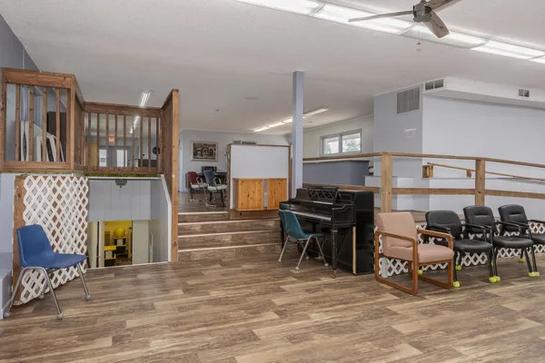 a room with furniture and wooden floor