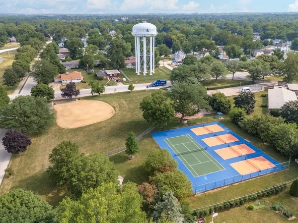 an aerial view of a dining space with a table and chairs