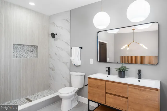 a bathroom with a bathtub and shower
