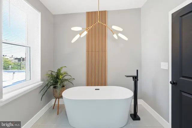 a bathroom with a double vanity sink toilet and a mirror