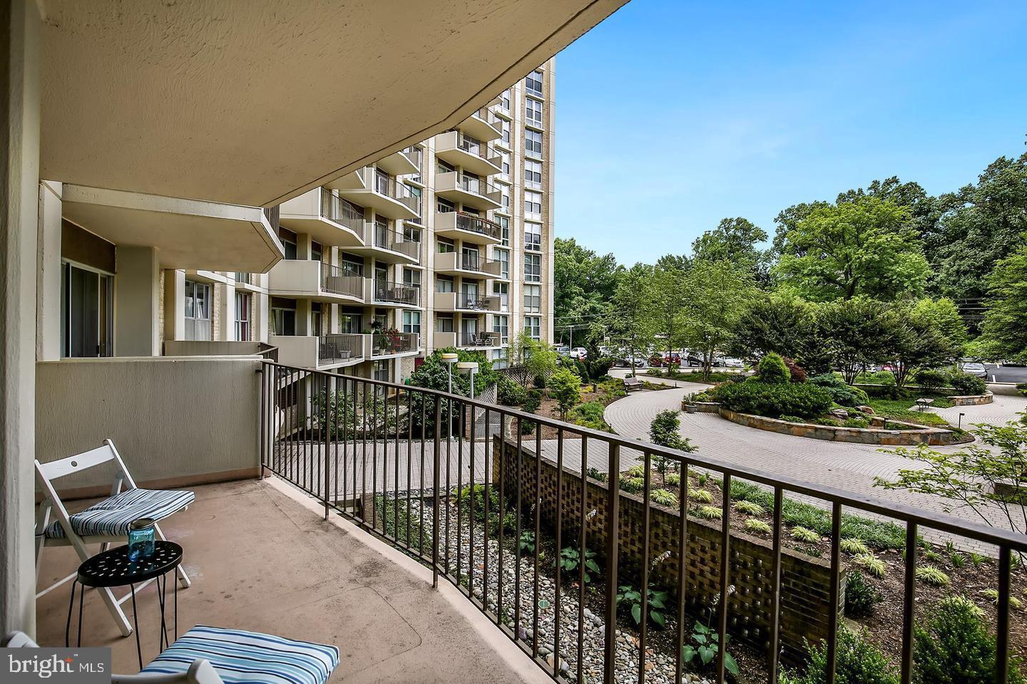 9039 Sligo Creek Parkway, Unit 205 Silver Spring, MD 20901 - Photo 17 of 28 a view of a balcony with wooden floor and fence