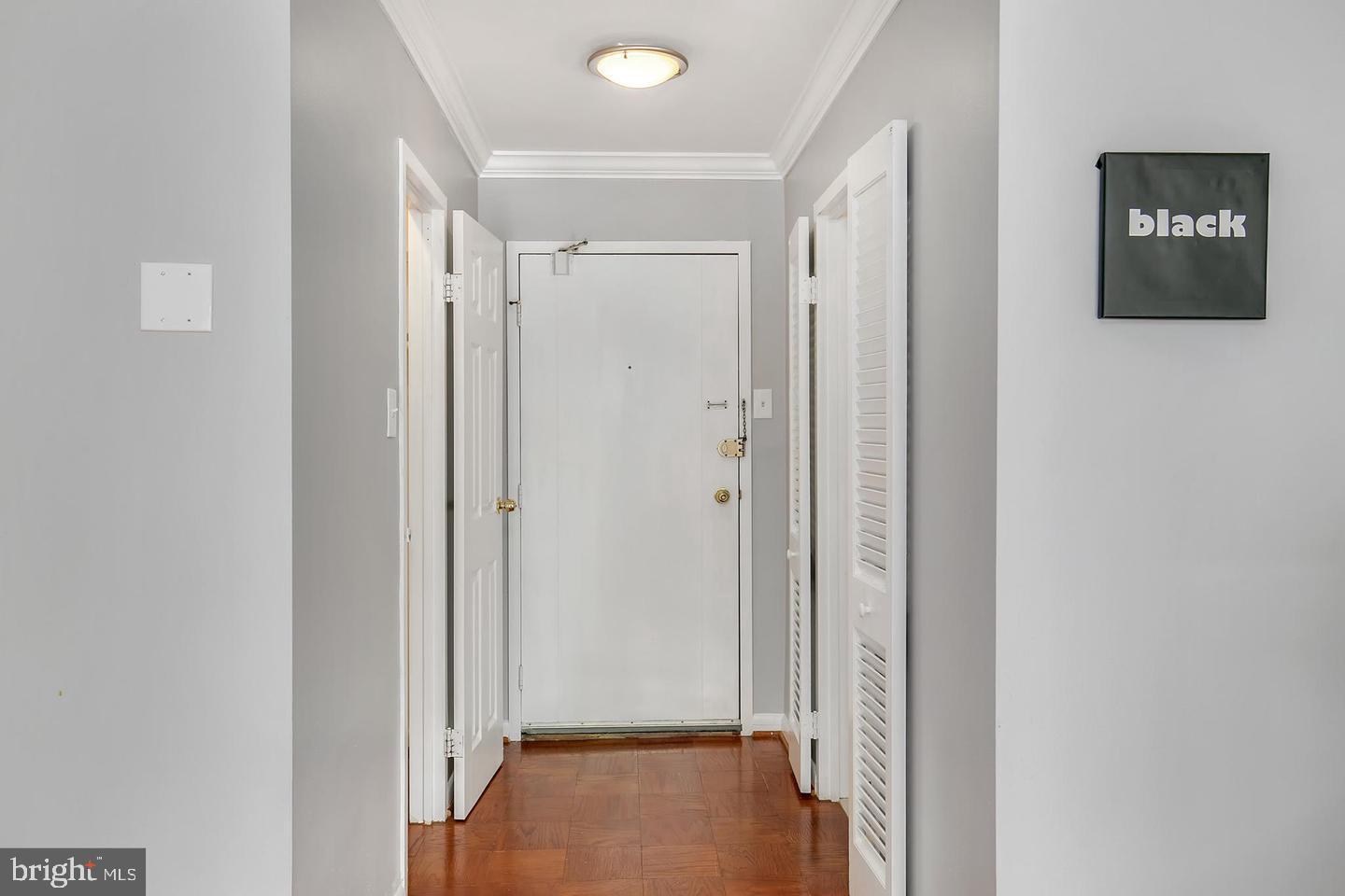 9039 Sligo Creek Parkway, Unit 205 Silver Spring, MD 20901 - Photo 2 of 28 a view of a hallway with paintings on the wall