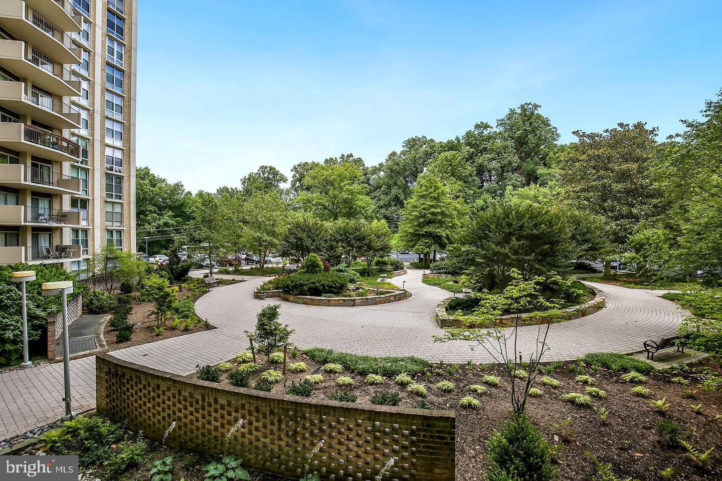 9039 Sligo Creek Parkway, Unit 205 Silver Spring, MD 20901 - Photo 24 of 28 a view of a garden with sitting area